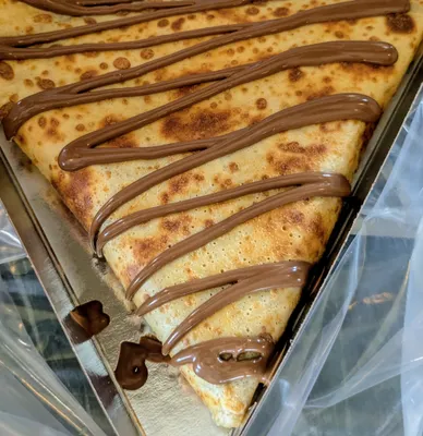 front view of a pancake corner with wonderfully melted chocolate strips on top