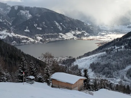 winter scene over a small lake with mountains
